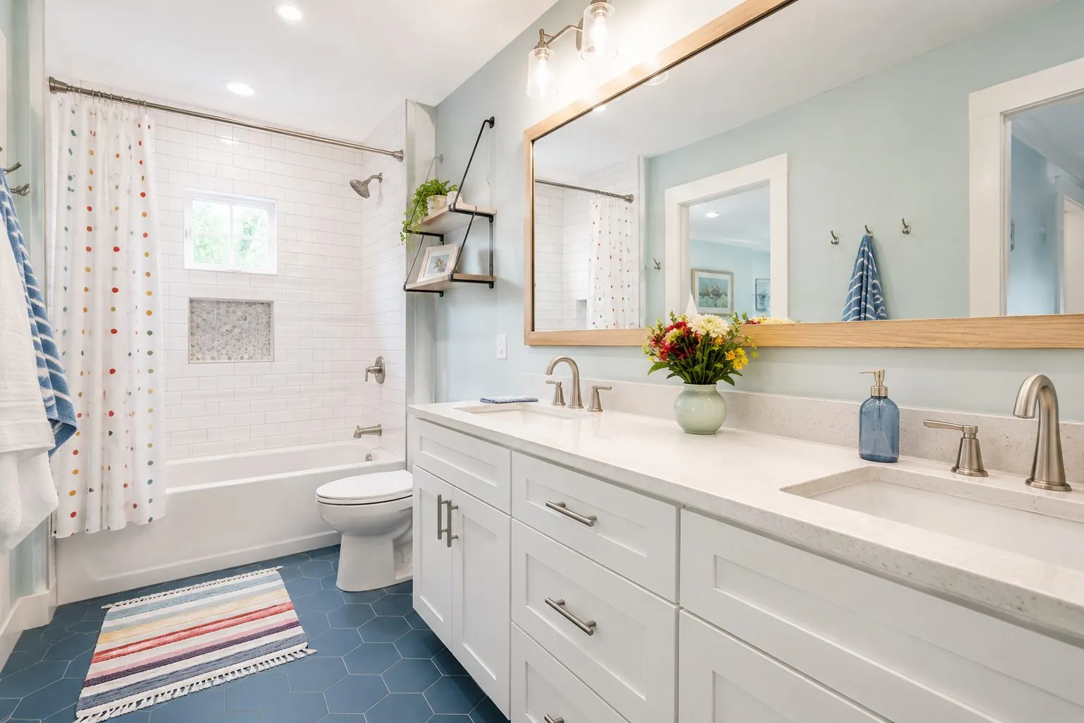Family bathroom remodel with a tub-shower combo and a white double vanity